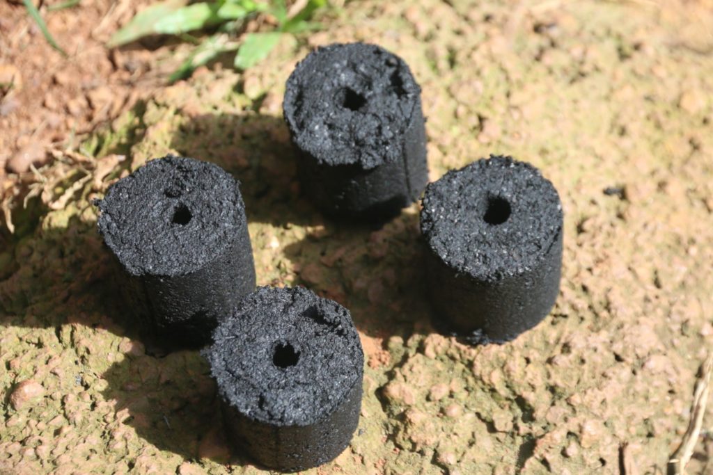 Manual piston made briquettes