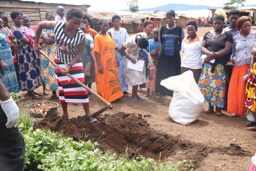 Trainees digging a pit for carbonizing